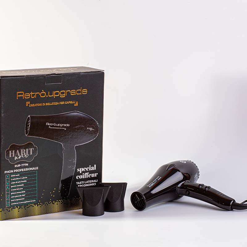 Phon nero con due convogliatori d'aria in primo piano e cartone esterno del phon posizionato sulla sinistra.