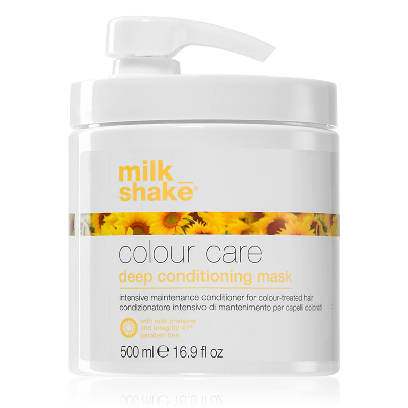 Vaso bianco con rifiniture giallo ocra con tappo a becco bianco e immagine di girasoli sul fronte.