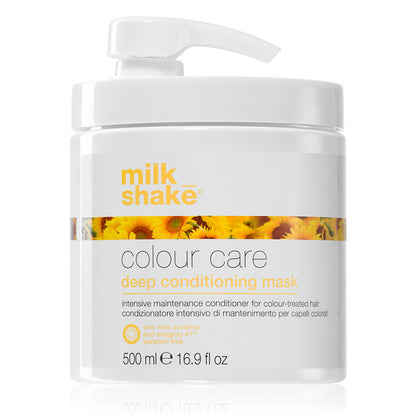 Vaso bianco con rifiniture giallo ocra con tappo a becco bianco e immagine di girasoli sul fronte.